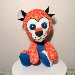 Orange and Pink Patterned Plush Animal Toy